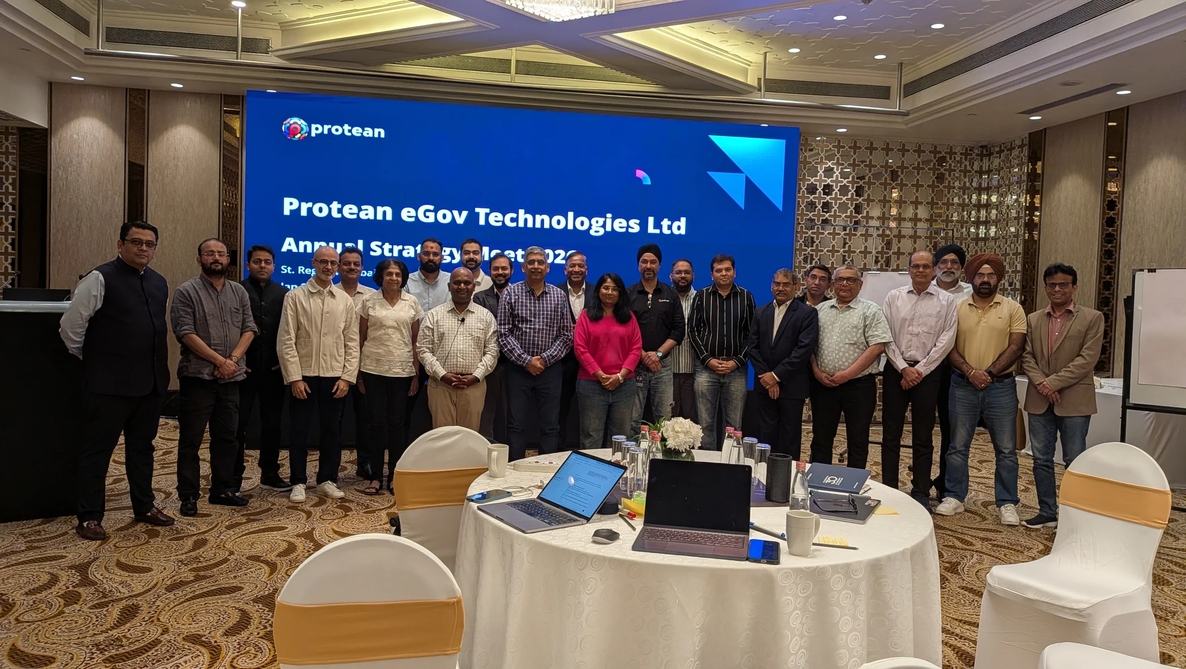 Rahul G. Iyer with a board and senior leadership group after an applied AI session